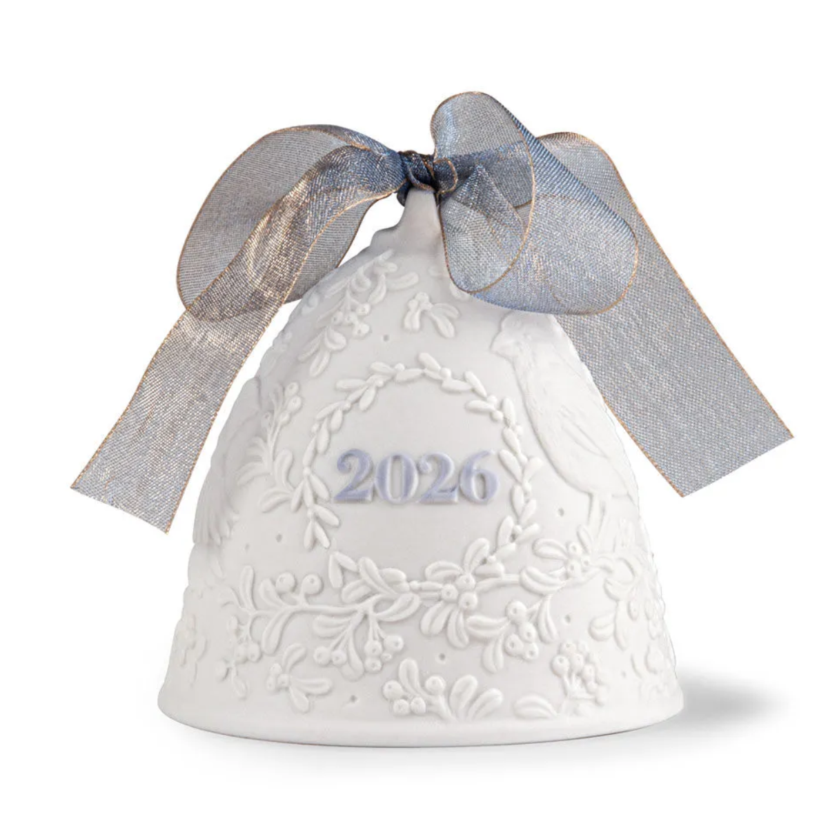 A white ceramic Christmas bell ornament with embossed floral patterns, featuring the year '2026' in silver on the front and a sheer silver-gray ribbon bow tied above it, set against a plain white background.