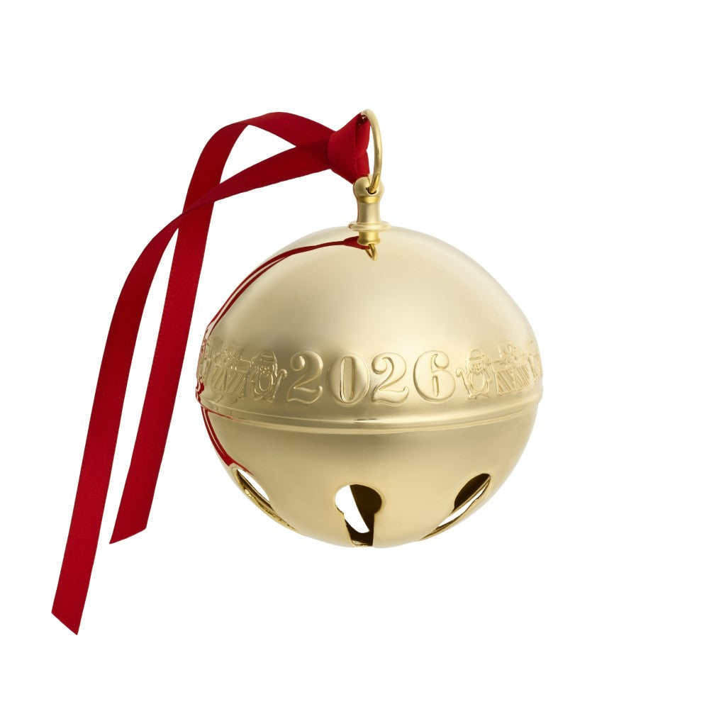 A shiny gold Christmas bell ornament with a red hanging ribbon, featuring embossed '2026' and Chinese characters on the front, isolated on a white background.
