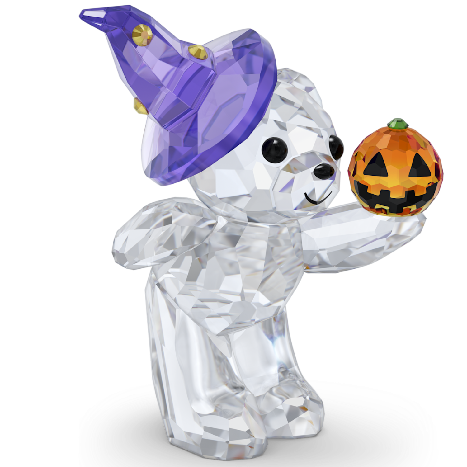 A clear faceted crystal bear figurine wearing a purple witch hat and holding a small orange jack-o'-lantern pumpkin, shown on a plain white background.