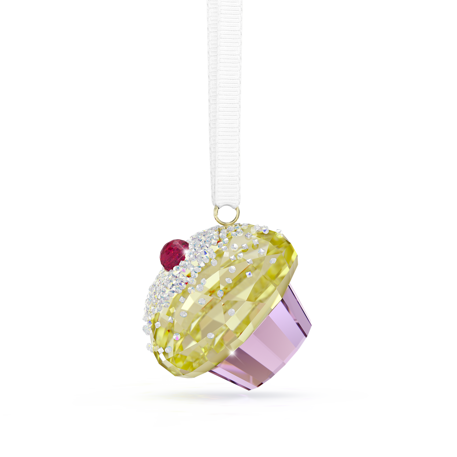 A cupcake-shaped hanging ornament with a faceted yellow frosting top, clear rhinestone-like crystals, a small red gem, and a lavender-purple base, suspended from a white ribbon on a white background.