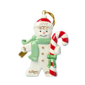 Christmas ornament of a snowman with a candy cane on a light blue background