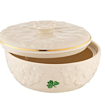Decorative ceramic bowl with lid featuring a shamrock design on a white background