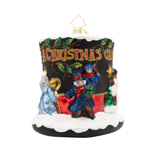 Decorative Christmas candle ornament with colorful figures and 'A Christmas Carol' text on a white background.