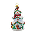 Decorative Christmas ornament shaped like a snowman with a house on its head, featuring birds and colorful details.