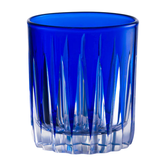 Blue glass tumbler with textured design on a white background