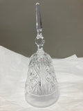 Crystal wine glass with a long stem on a white fabric background