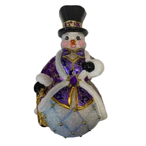 Decorative snowman figurine with purple coat and top hat on a white background