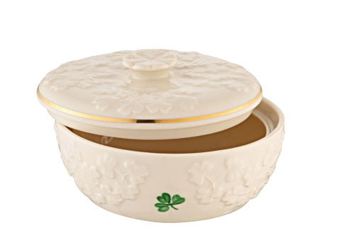 Decorative ceramic bowl with lid featuring a shamrock design on a white background