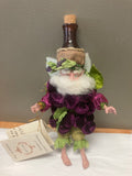 Artistic depiction of a bottle with floral and leaf decorations against a neutral background