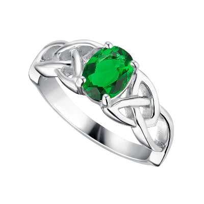 A silver ring featuring a central oval-cut green gemstone, surrounded by a Celtic knot design with small clear accent stones, shown on a plain white background.