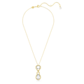 A gold-tone plated Swarovski Dextera drop pendant featuring two bezel-set crystals in pear and octagon cuts, connected by a chain.
