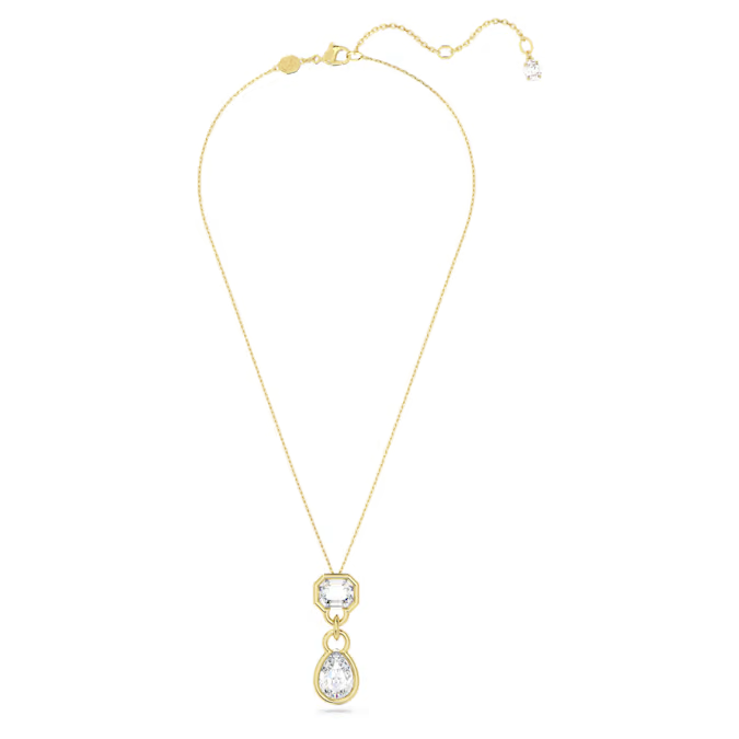A gold-tone plated Swarovski Dextera drop pendant featuring two bezel-set crystals in pear and octagon cuts, connected by a chain.