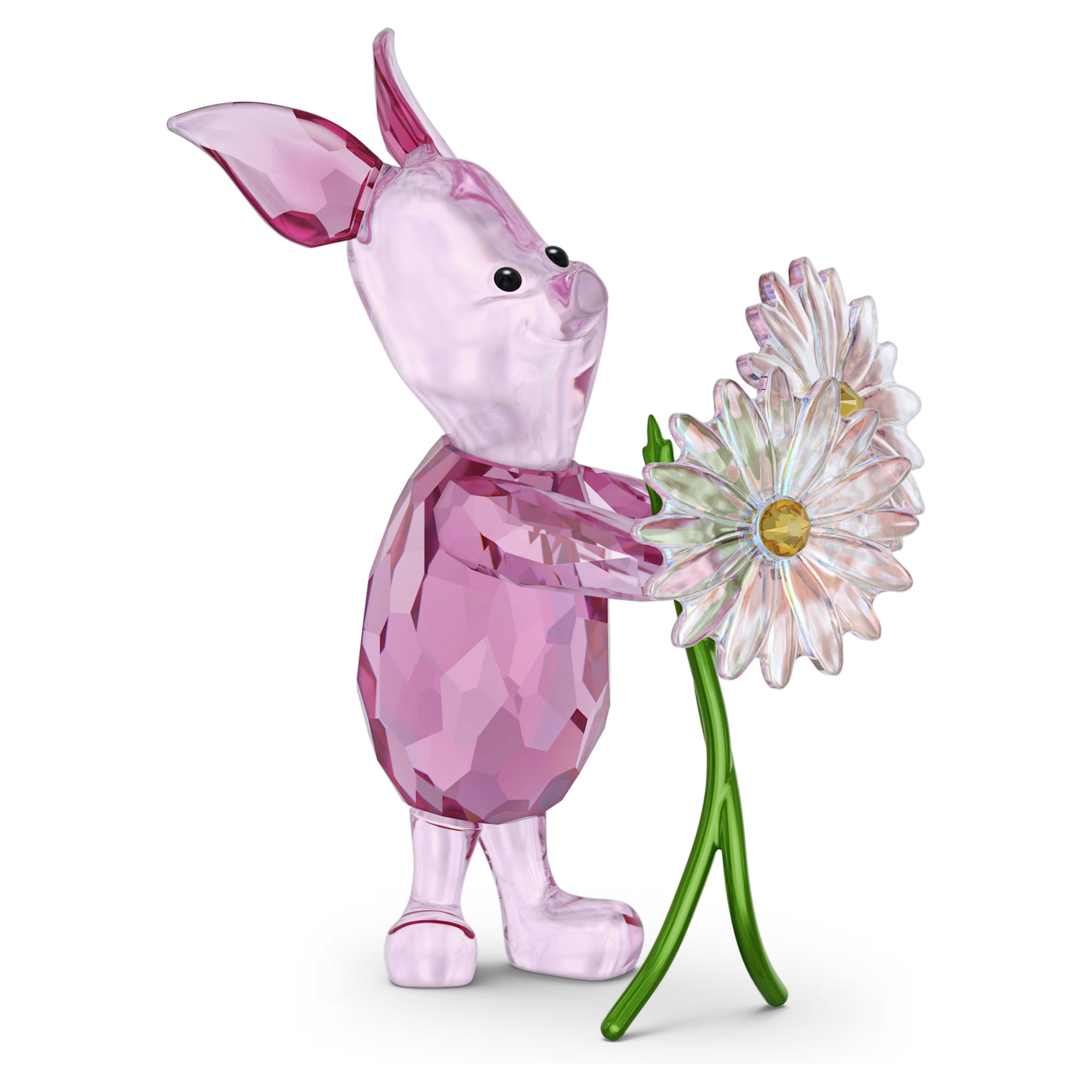 Crystal pig figurine holding a flower on a white background